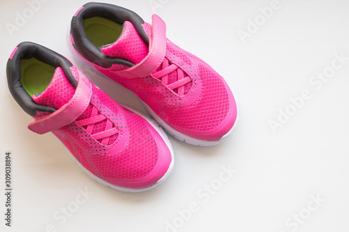 modern pinky sport shoes .Pair of sport shoes on colorful background. New sneakers on soft green background, copy space. running shoes.Pink sneakers.Pair of pink training shoes for girls.ladies women
