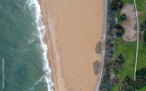 Aerial Top View Photo Background from Flying Drone Above grass waves Sea Water