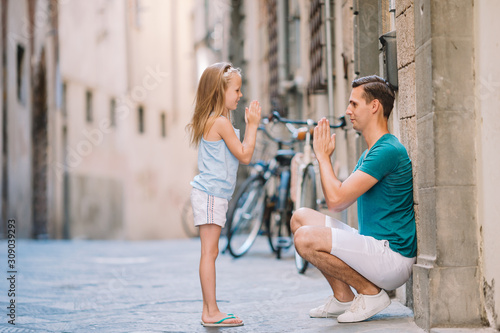 Happy father and little adorable girl in Rome during summer italian vacation