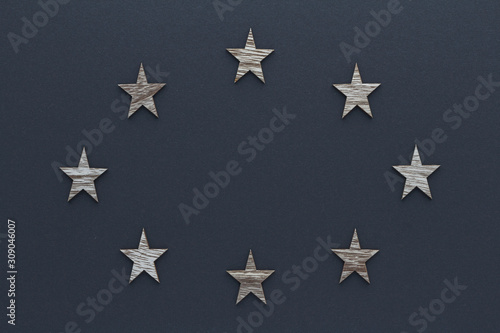 Christmas composition. Wood stars on blue background top view background with copy space for your text. Flat lay.