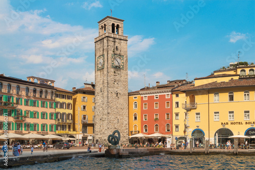 Fotografie RIVA DEL GARDA, ITALY - JUNE 6, 2019: The harbor and Torre Apponale tower