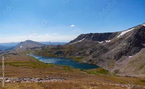 Looking down on a sparkling high altitude lake and the mountains beyond from the Beartooth Highway.