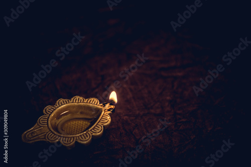Diwali traditional Diya lamp on floor background