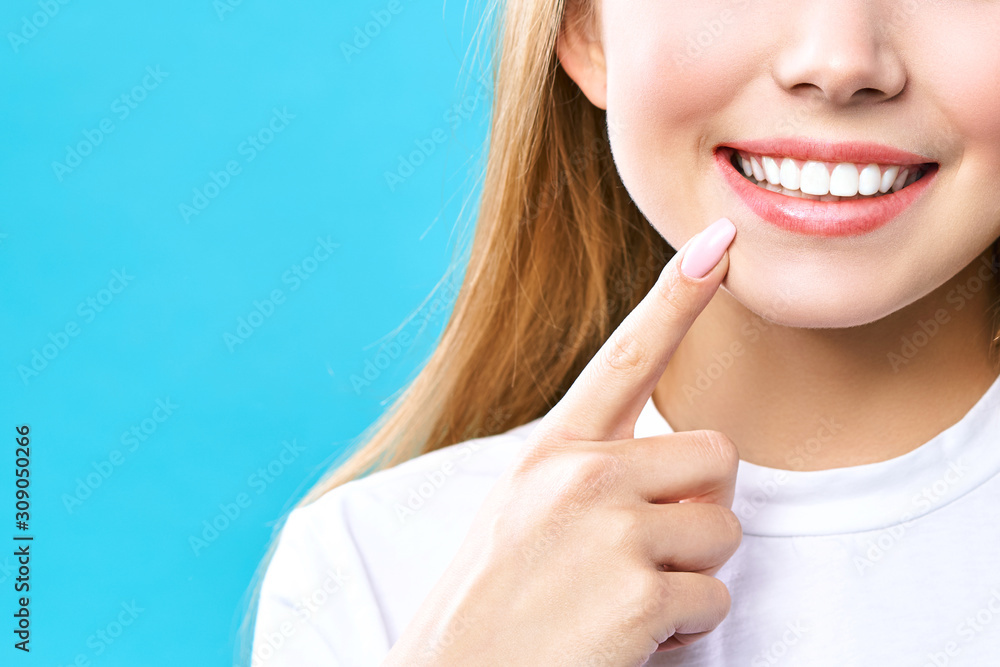 Perfect healthy teeth smile of a young woman. Teeth whitening. Dental clinic patient. Image symbolizes oral care dentistry, stomatology. Dentistry image. Perfect healthy teeth smile of a young woman. Teeth whitening. Dental clinic patient. Image symbolizes oral care dentistry, stomatology. Dentistry image.