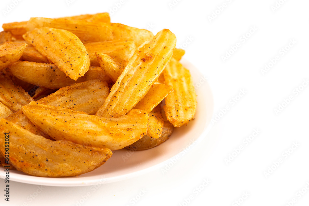 Pile of Spiced Potato Wedges Isolated on a White Background Pile of Spiced Potato Wedges Isolated on a White Background