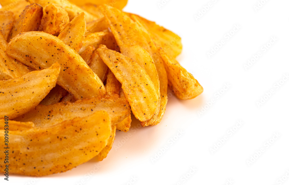 Pile of Spiced Potato Wedges Isolated on a White Background Pile of Spiced Potato Wedges Isolated on a White Background