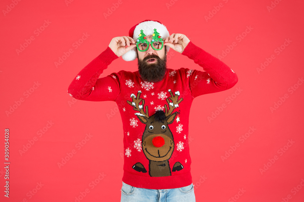 Awesome Christmas. knitwear fashion. winter holiday celebration. ho ho ho. bearded man santa hat. christmas is here. man in xmas party glasses. happy new 2020 year. funny hipster knitted sweater Awesome Christmas. knitwear fashion. winter holiday celebration. ho ho ho. bearded man santa hat. christmas is here. man in xmas party glasses. happy new 2020 year. funny hipster knitted sweater