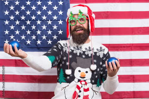 Winter greetings. Having fun. Joy concept. Cheerful hipster. Great american Christmas. Happy santa american flag background. Bearded american man. Celebrate Christmas and new year american way © be free