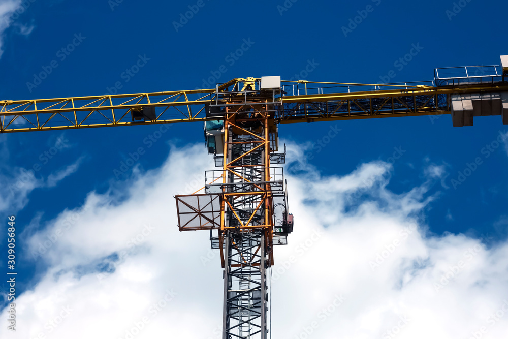 Naklejka premium Crane, sky background with clouds