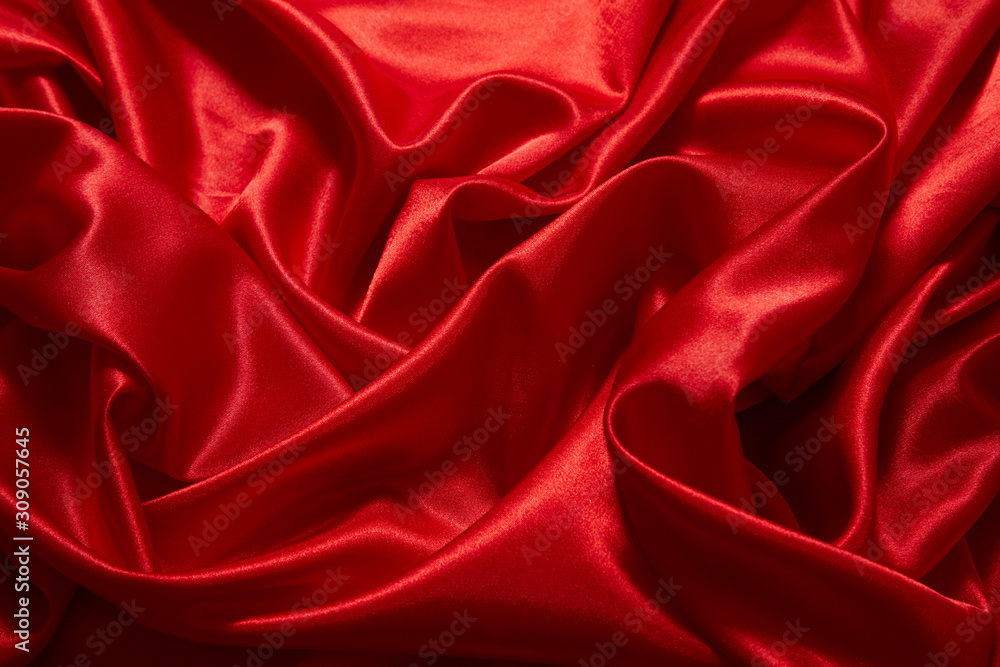 Luxury red satin smooth fabric background for celebration, ceremony, event invitation card or advertising poster Luxury red satin smooth fabric background for celebration, ceremony, event invitation card or advertising poster