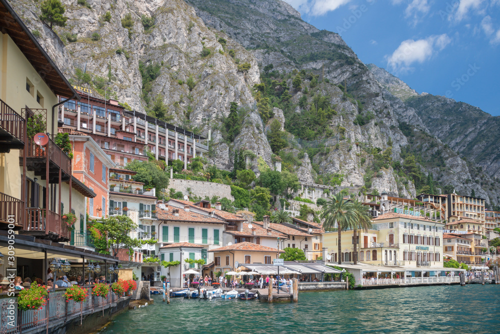 LIMONE SUL GARDA, ITALY - JUNE 13, 2019: The little town under the alps rocks.