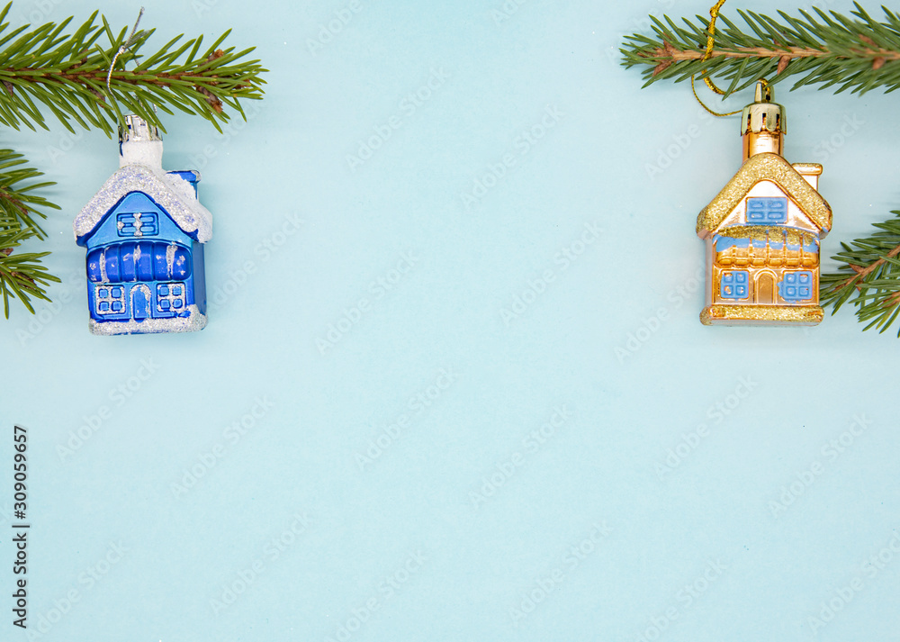 Christmas decor and fir branches on a gentle blue background.