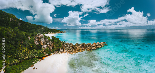 Aerial panoramic view of beautiful Grand Anse beach on La Digue island in Seychelles
