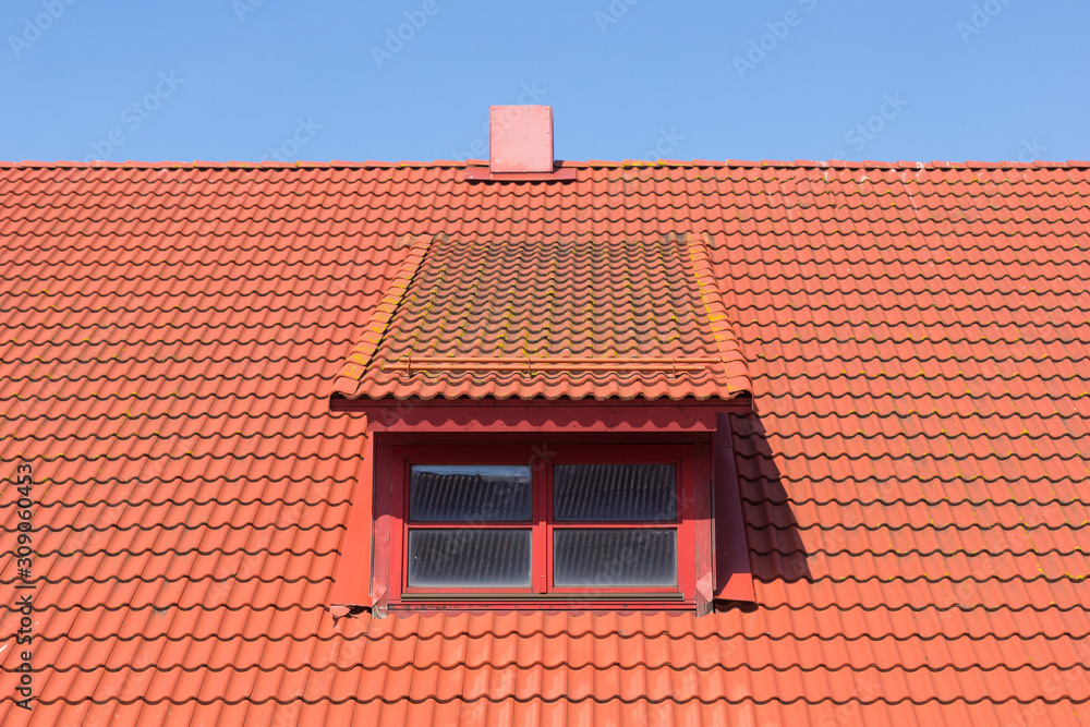 red tile roof with window and chimney