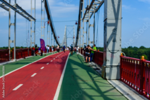 Defocused blurred background of the people on bridge