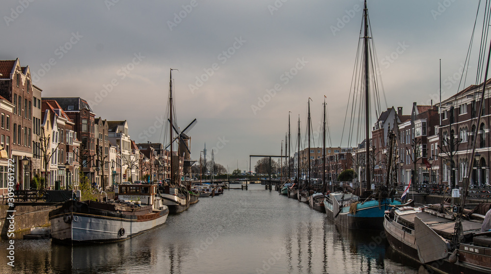 View from the Piet Heynsbridge to the Aelbrechtskolk of the historic Delfshaven and the Windmill 