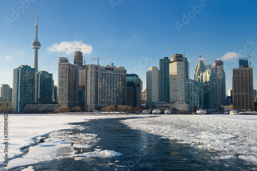 Photography Ice breaking path of Wards Island Ferry on frozen Lake Ontario in Toronto winter