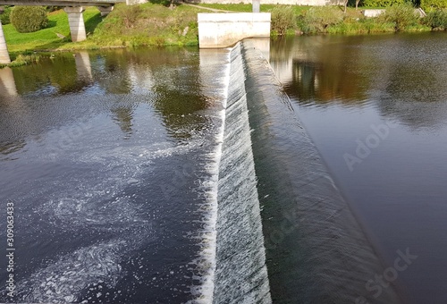 Artificial dam on the Pskova river in the Russian city of Pskov in September photo