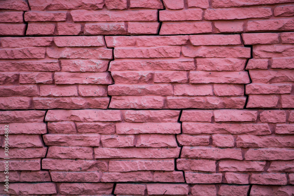 Obraz premium Pink stone wall, house facade