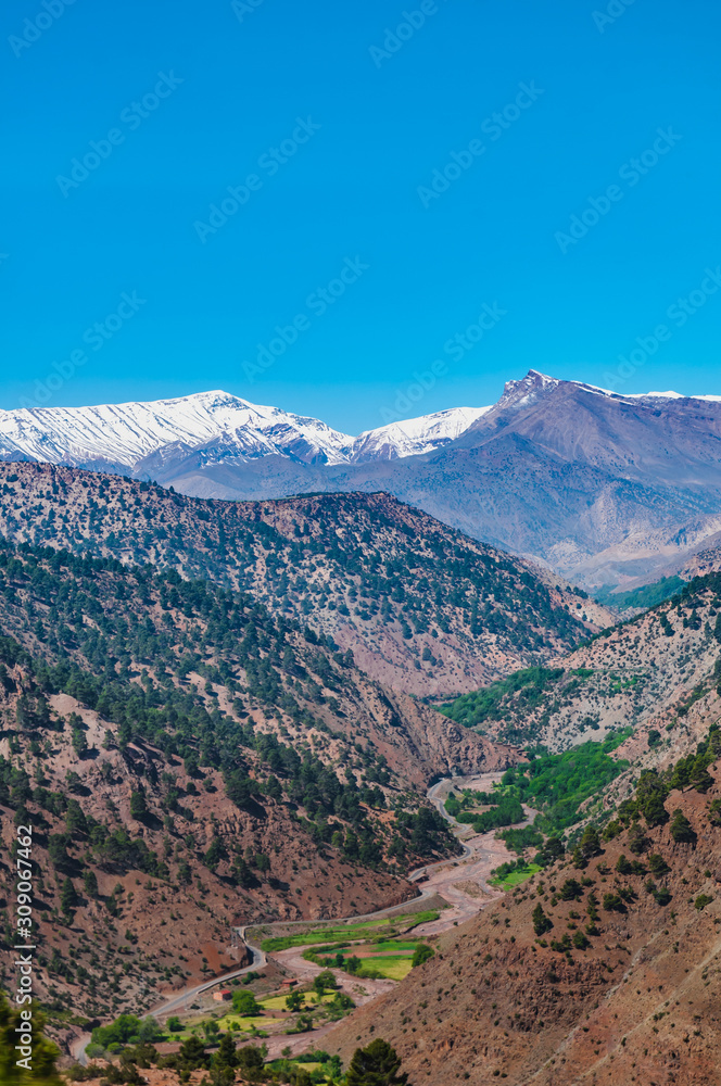 View of the high snow-capped mountains in the Atlas Mountains in Morocco
