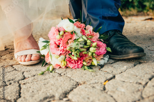 bride and groom shoes with flowers
