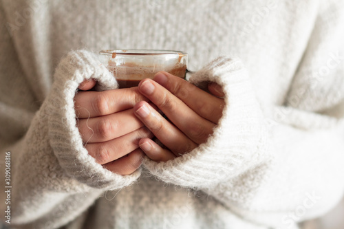 Female hands holding a cup of hot chocolate