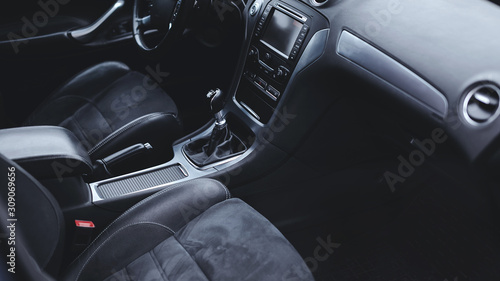luxury car Interior - multimedia display, steering wheel, shift lever and dashboard. 