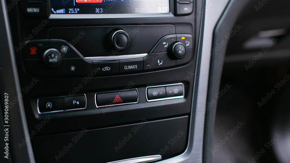 Emergency gang button and the air conditioner close up.