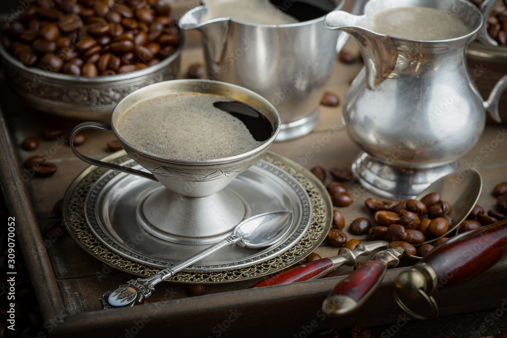 Black coffee on an old background in a cup Black coffee on an old background in a cup