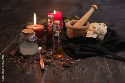 potion of natural herbs for black magic with candles