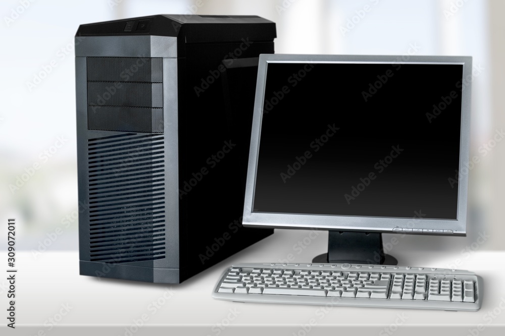 Modern desktop computer and keyboard on desk Modern desktop computer and keyboard on desk