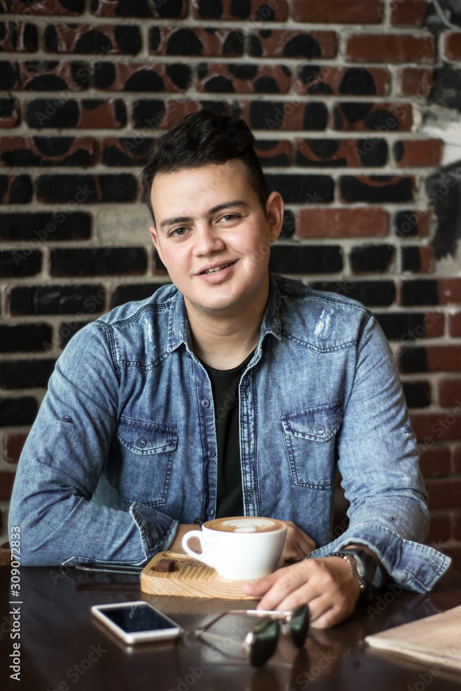 young man in a coffee shop young man in a coffee shop