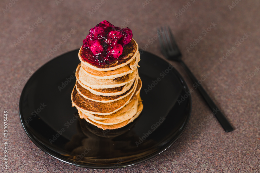 vegan banana pancakes stack with exotic dragonfruit coulis on top vegan banana pancakes stack with exotic dragonfruit coulis on top