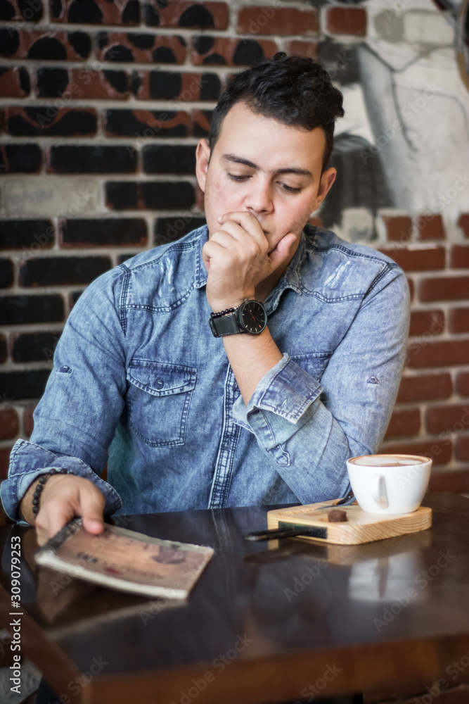 young man in a coffee shop young man in a coffee shop