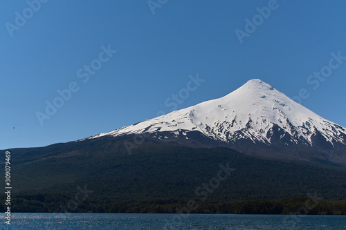The Osorno volcano seen from Ensenada near Puerto Varas in South Chile. Nature and blue sky.