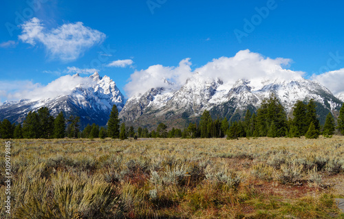 The beauty of September in the Tetons shows changing colors in the meadows and snow on the mountains.