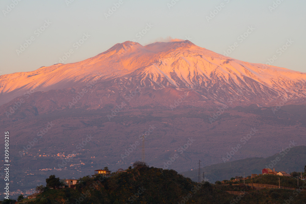 Taormina - The Mt. Etna volcano over the Sicilian landscape in the morning light.