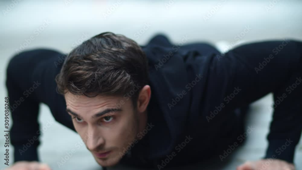 Closeup fit man pushing up outdoor. Close up sport man doing push up exercise Closeup fit man pushing up outdoor. Close up sport man doing push up exercise