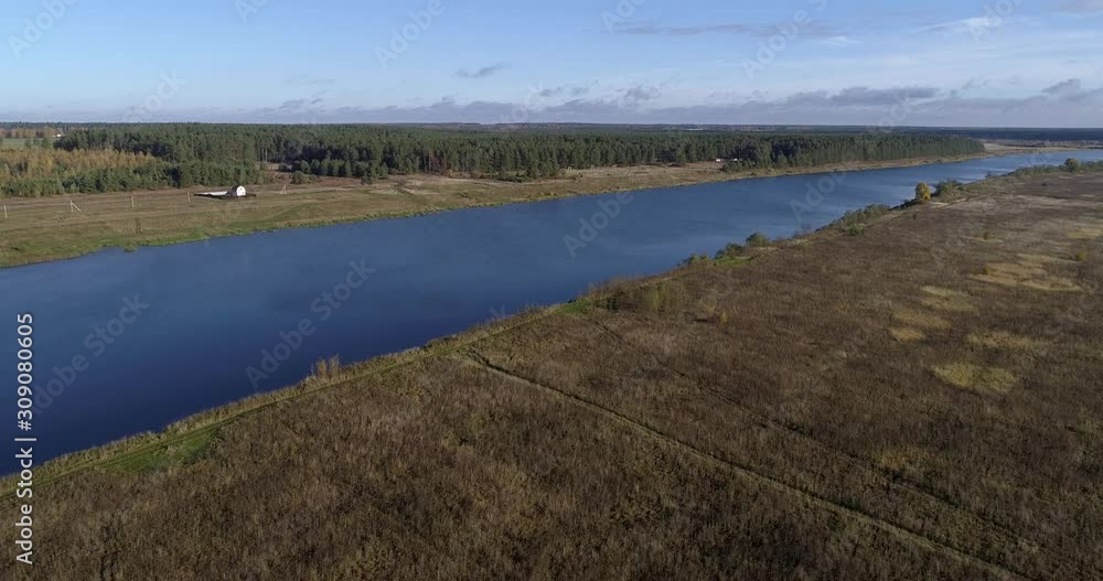 Drone aerial video panorama of hamlet with houses and gardens on a river surrounded by background sky and clouds with stunning landscape cinematic views. Concept climate outdoor nature. Drone aerial video panorama of hamlet with houses and gardens on a river surrounded by background sky and clouds with stunning landscape cinematic views. Concept climate outdoor nature.