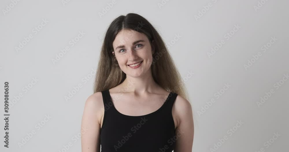 Happy young woman in tank top over white background Happy young woman in tank top over white background