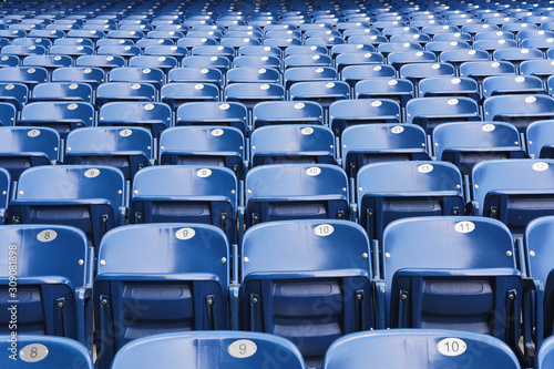 Empty blue stadium seats, empty bleachers
