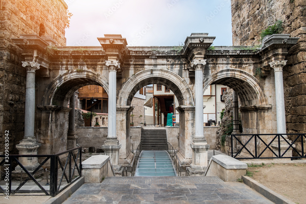 Fototapeta premium Resort city Antalya turkey travel famous landmark - arch walkway architecture view of Hadrian's Gate in old city