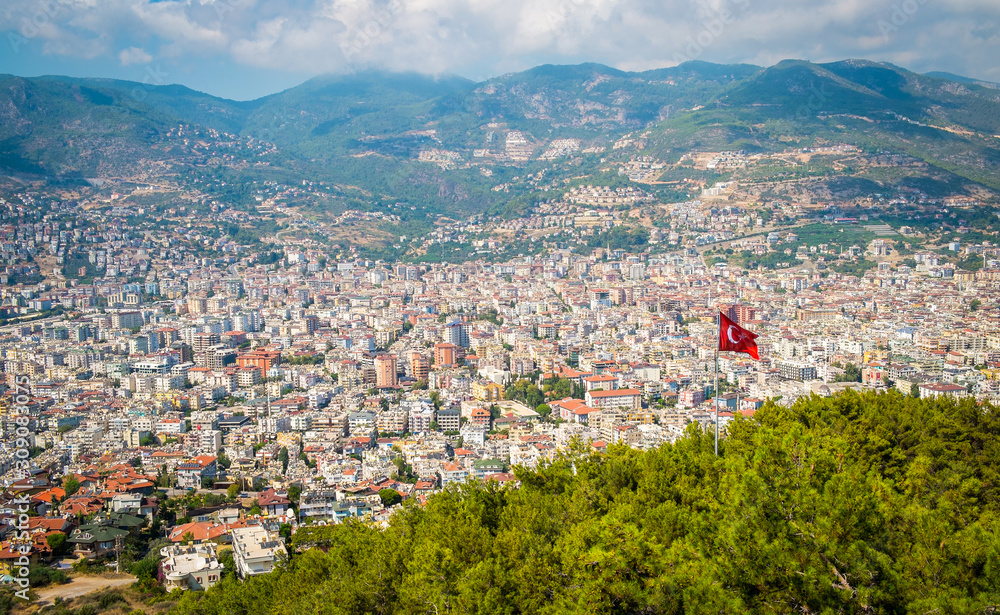 Alanya top view on the mountain with turkey flag and city background - Beautiful Alanya Turkey landscape travel landmark
