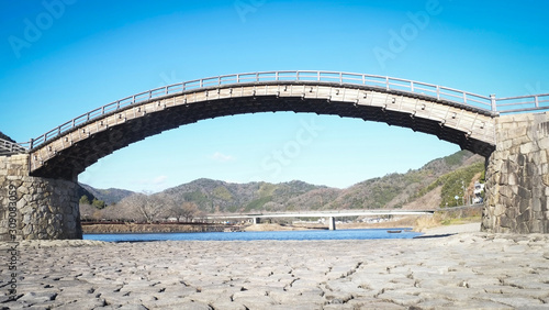 Iwakuni Yamaguchi Japan Kintaikyo Bridge over the Nishiki River with blue sky - The 5-arched wooden bridge is a cultural property of Japan