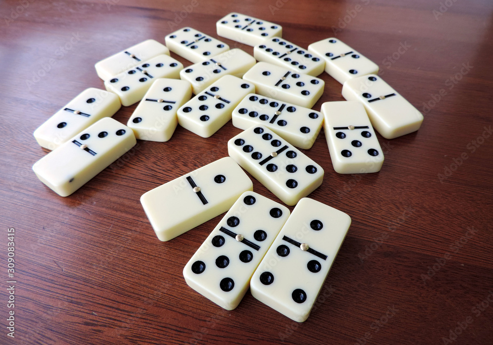 A set of Domino pieces on the wooden table A set of Domino pieces on the wooden table