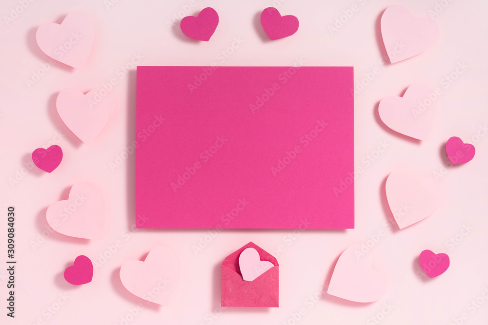 Valentine's day frame composition. Purple pink hearts blank sheet of paper on pastel pink background. Top view, flat lay, copy space