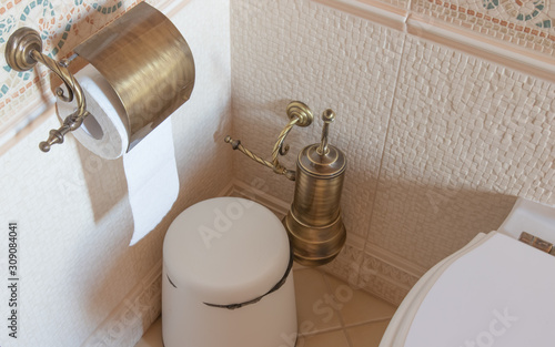 toilet paper holder hanging on the wall