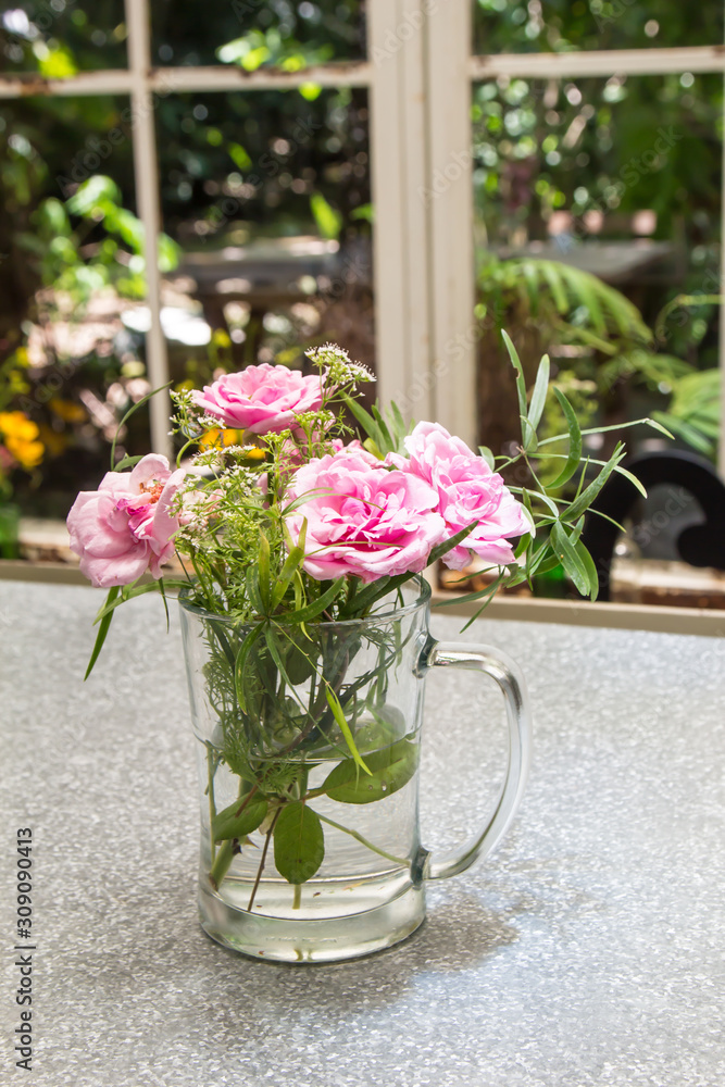 Beautiful flower arrangement in glass vase on the table Beautiful flower arrangement in glass vase on the table
