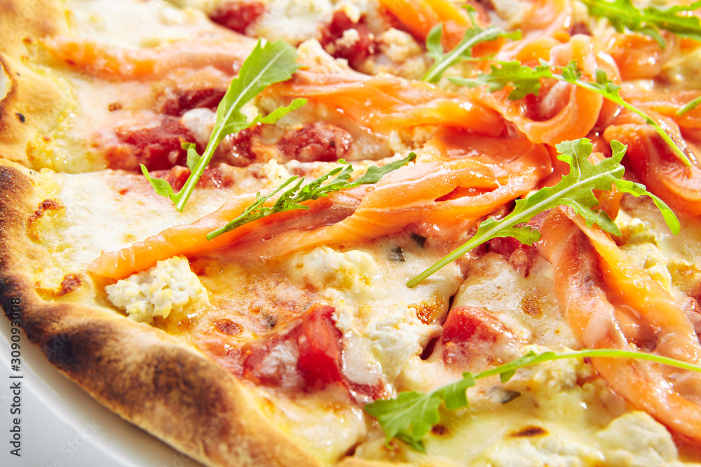 Pizza with Salmon, Cream Cheese and Fresh Rucola Leaves Isolated Side View Pizza with Salmon, Cream Cheese and Fresh Rucola Leaves Isolated Side View