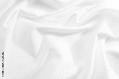 Abstract white fabric texture background. Cloth soft wave. Creases of satin, silk, and cotton. 